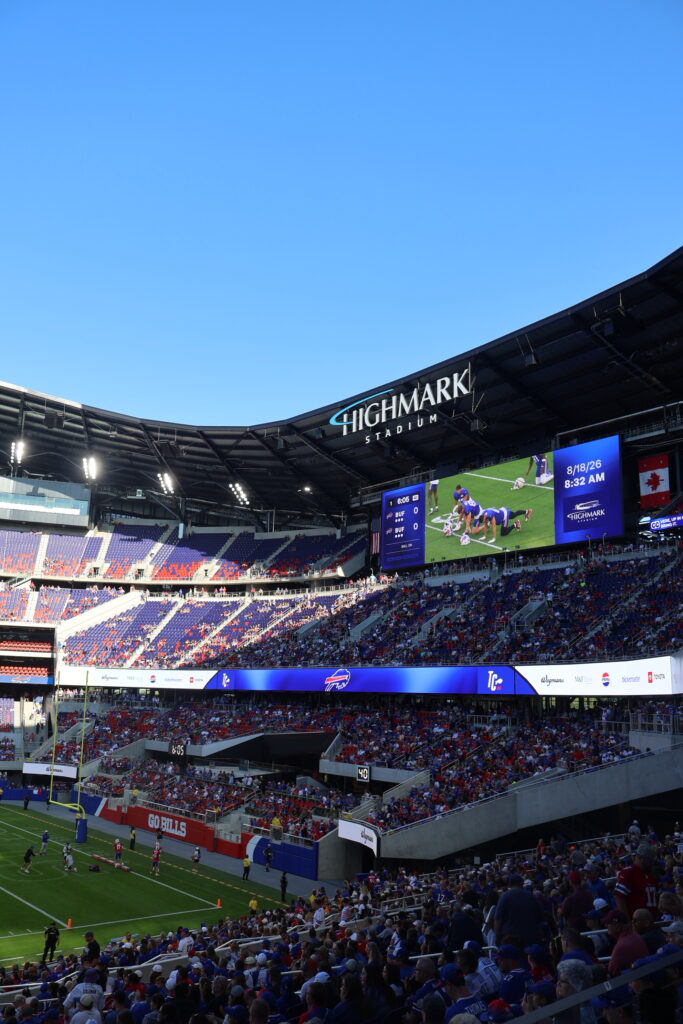 Highmark Stadium seen from the upper stands, with the scoreboard showing play