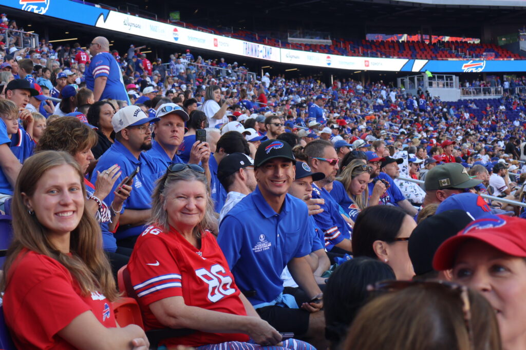 Attendees seated in the stands among Buffalo Bills fans