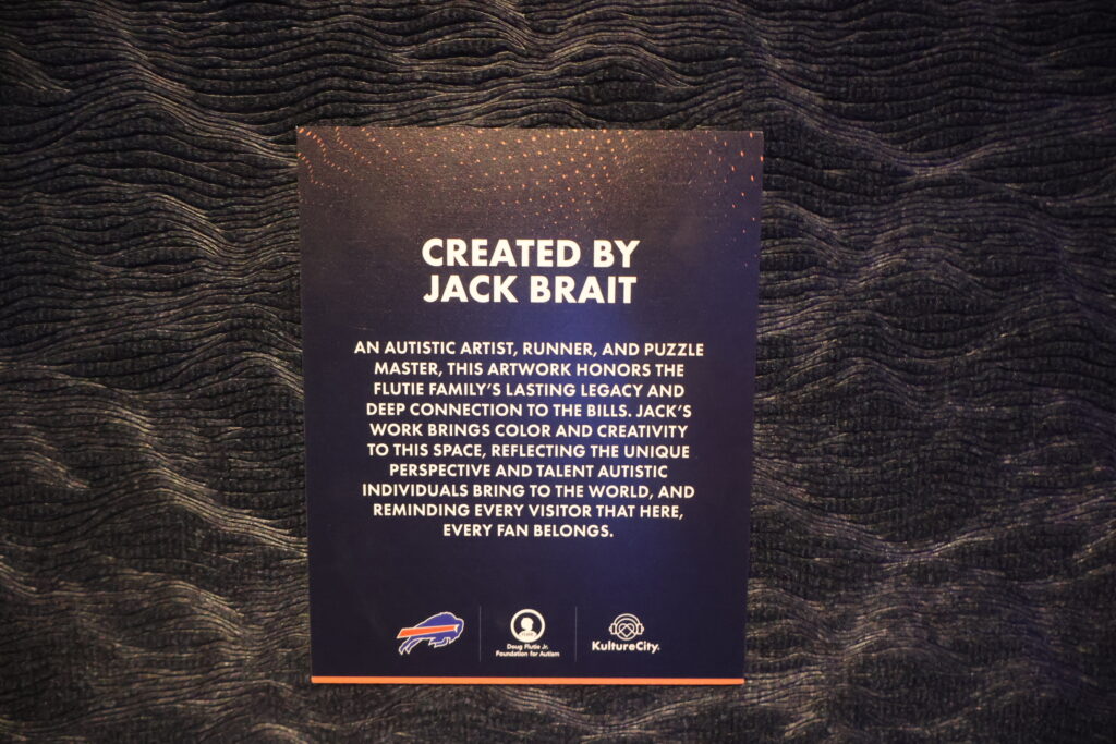 A wall panel crediting the sensory room artwork to the artist Jack Brait