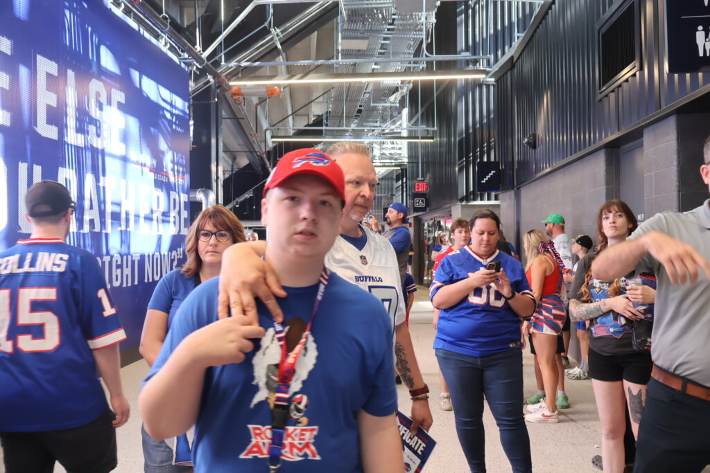 A young attendee on the concourse in a Buffalo Bills jersey