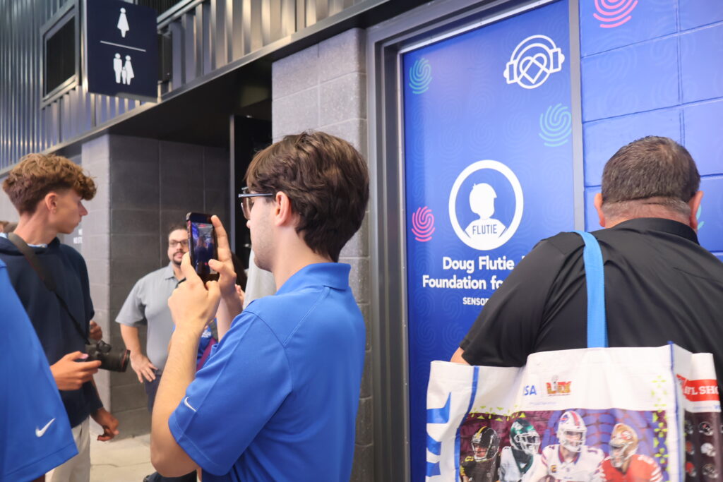 An attendee photographing the sensory room entrance