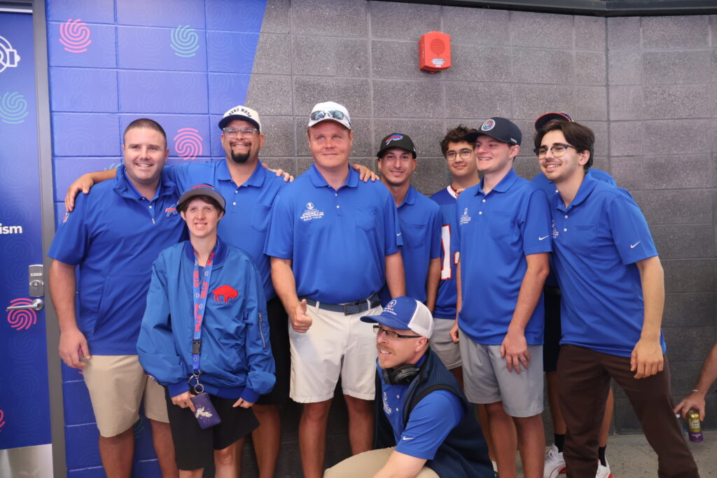 The group posing together at the sensory room entrance