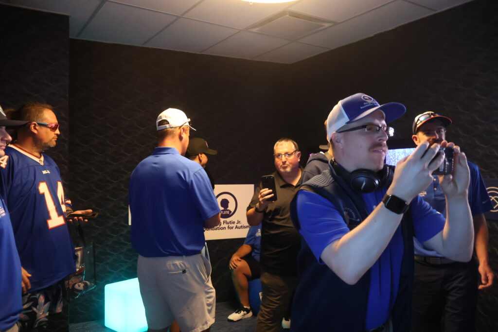 Visitors trying out the sensory room's interactive light panels
