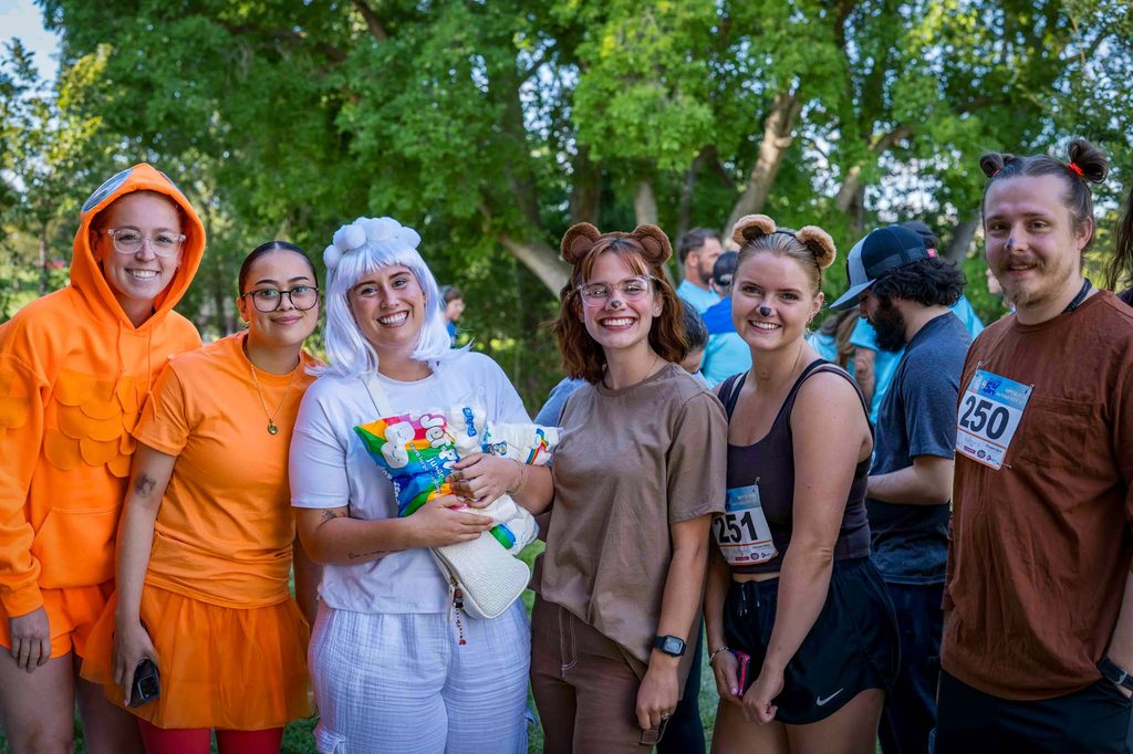 A group of participants in costume gathered before the start