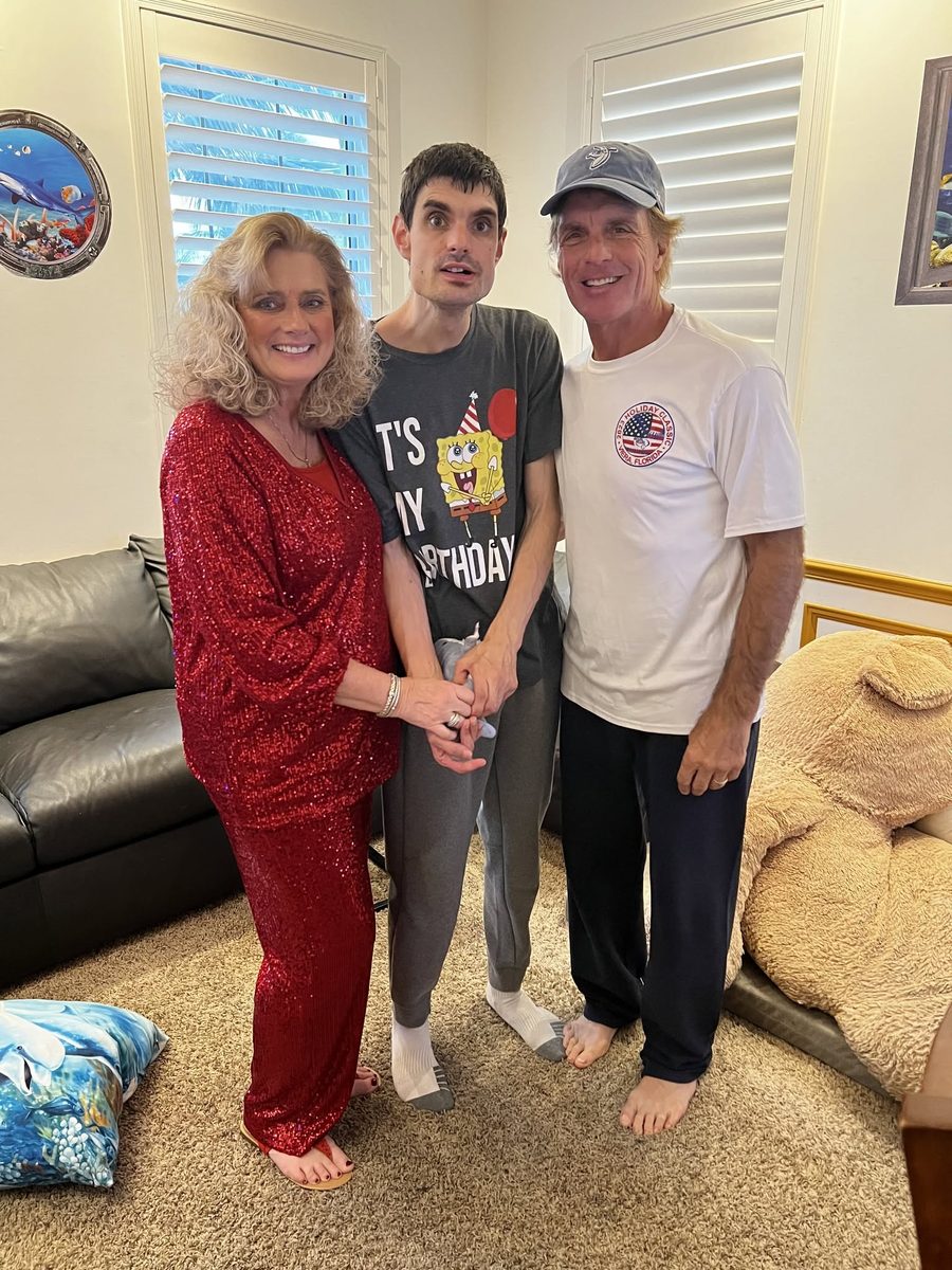 Doug and Laurie Flutie at home with their son Dougie on his birthday